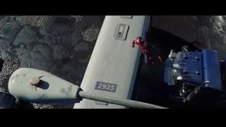 Spider-Man flying over street with tank — The Amazing Spider Man 2