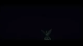 statue of people on horseback at night — John Wick: Chapter 4