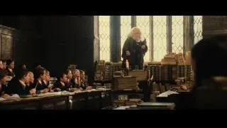 students listening to lecture by old man in hall — Harry Potter and the Philosophers Stone