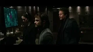 three people focused on city map monitor — Now You See Me 2