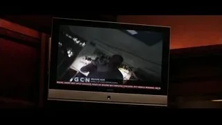 TV screen displaying breaking news on wooden wall — Batman: The Dark Knight