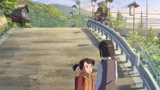 two girls on stone pathway by house — Your Name