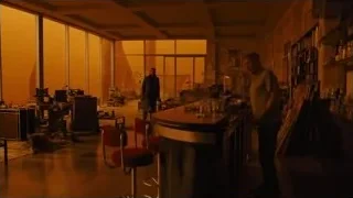 two men at dimly lit bar counter — Blade Runner 2049