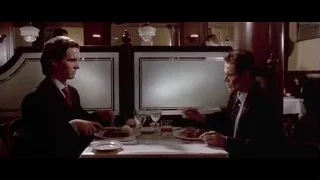 two men in suits dining in restaurant — American Psycho