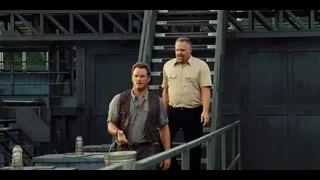 two men on industrial stairs with bucket — Jurassic World