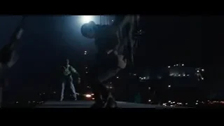 two men with gun in dark alley — Iron Man 3