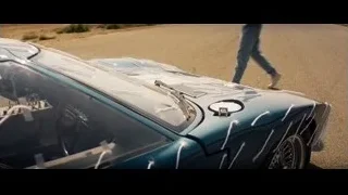 two men with vintage blue sports car — Ford v Ferrari