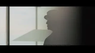 Two people with gun in dark room — Creed 2