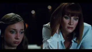 Two women in dimly lit room — Jurassic World