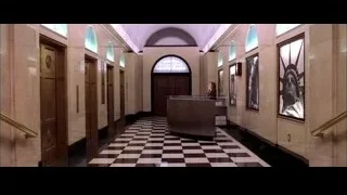 woman at reception desk in hallway — Spider Man 2