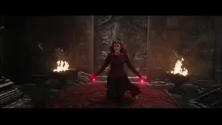 woman holding red orb in dark room — Doctor Strange 2