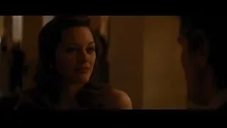 Woman in dimly lit room close-up — Batman: The Dark Knight Rises
