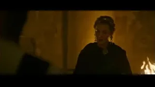 woman in dimly lit room with fire — Gladiator 2