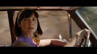 Woman in vintage car driver's seat — Ford v Ferrari