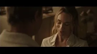 woman looking at camera in dimly lit room — F1