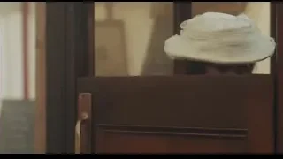 woman peeking from behind door in large hat — Peaky Blinders