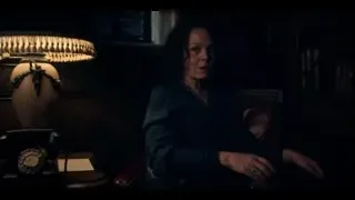 Woman sitting at desk in dark room — Peaky Blinders