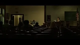 woman speaking at podium in lecture hall — Fight Club