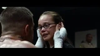 woman with glasses looking at man — Southpaw