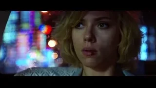 Woman's serious face on city street at night — Lucy