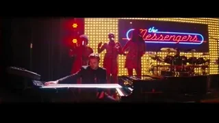 women singing on stage with neon sign — La La Land
