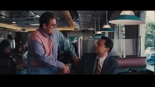 yellow vintage car parked by restaurant — The Wolf Of Wall Street
