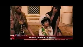 young boy with gun on chair — The Dictator
