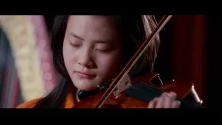 young girl playing violin with eyes closed — The Karate Kid