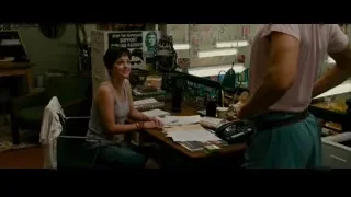 Young man and woman conversing in room — The Dictator