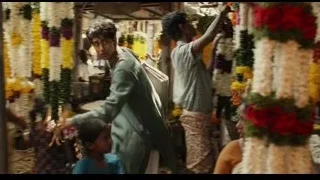 young man at busy flower market — Life of Pi