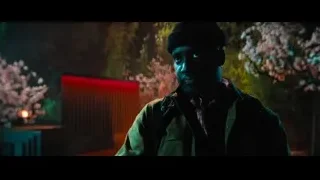 young man in beanie in park at night — John Wick: Chapter 4