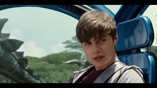 Young man in blue car with dinosaurs — Jurassic World