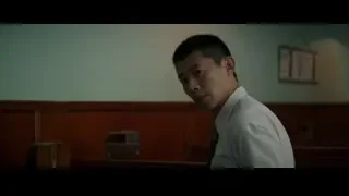 young man in courtroom deep in thought — Bruce Lee: Birth of The Dragon