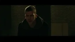 young man in dark coat by brick wall — Now You See Me 2