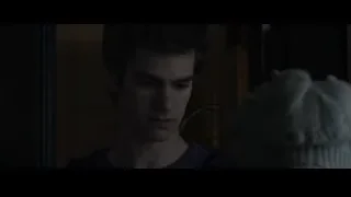 young man in dimly lit room thinking — The Amazing Spider Man