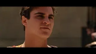 Young man in red gold outfit eyes closed — Gladiator
