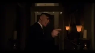 Young man in suit in dimly lit room with candles — Peaky Blinders