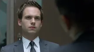 Young man in suit standing in front of mirror — Suits