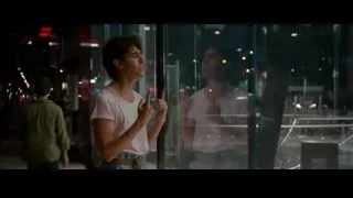 young man looking at city from window — The Dictator