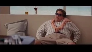 young man on couch with ocean view — The Wolf Of Wall Street