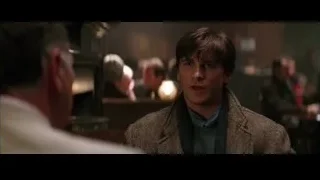Young man sitting in dimly lit bar — Batman