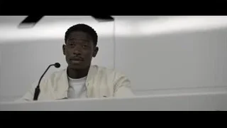 Young man speaking into microphone — F1