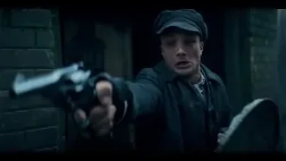 young man standing in brick alleyway — Peaky Blinders