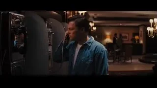 Young man talking on payphone — The Wolf Of Wall Street