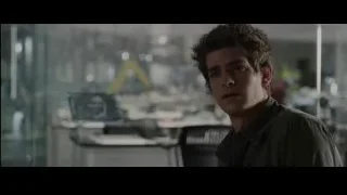 young man with serious expression in office — The Amazing Spider Man