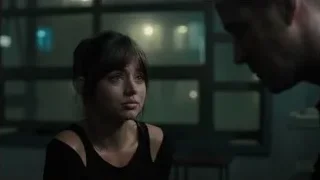young woman and man in dim room — Blade Runner 2049
