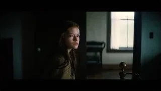 young woman in dimly lit room — Interstellar